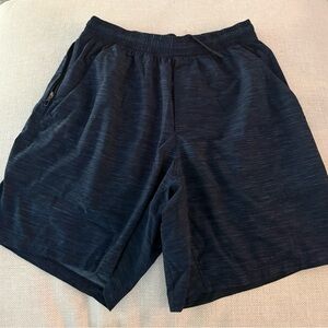 Lululemon Men's Pace Breaker Linerless Short, 7" Size Med. - Navy
